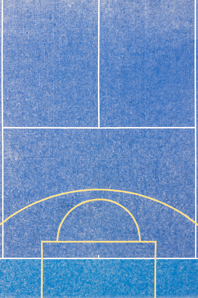 Aerial view of a blue sports court with white and yellow lines marking boundaries and a goal area.