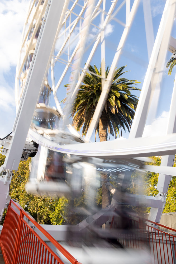 Ferris wheel in motion creating blurred effect