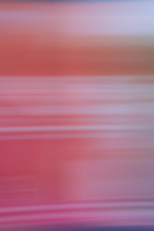 Abstract background with horizontal lines in shades of pink, red, and purple. The lines are blurred and create a soft, gradient effect.
