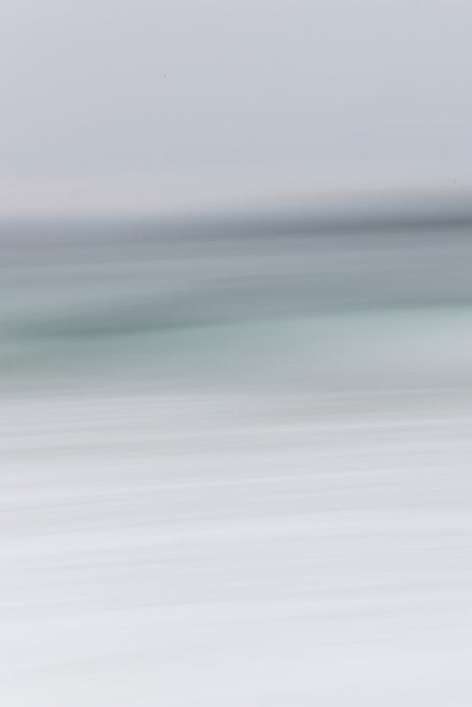 Abstract image with horizontal lines of varying shades of gray and white, suggesting a blurred landscape or a minimalist design.