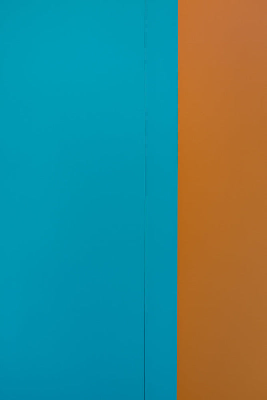 A solid, bright teal blue and orange background