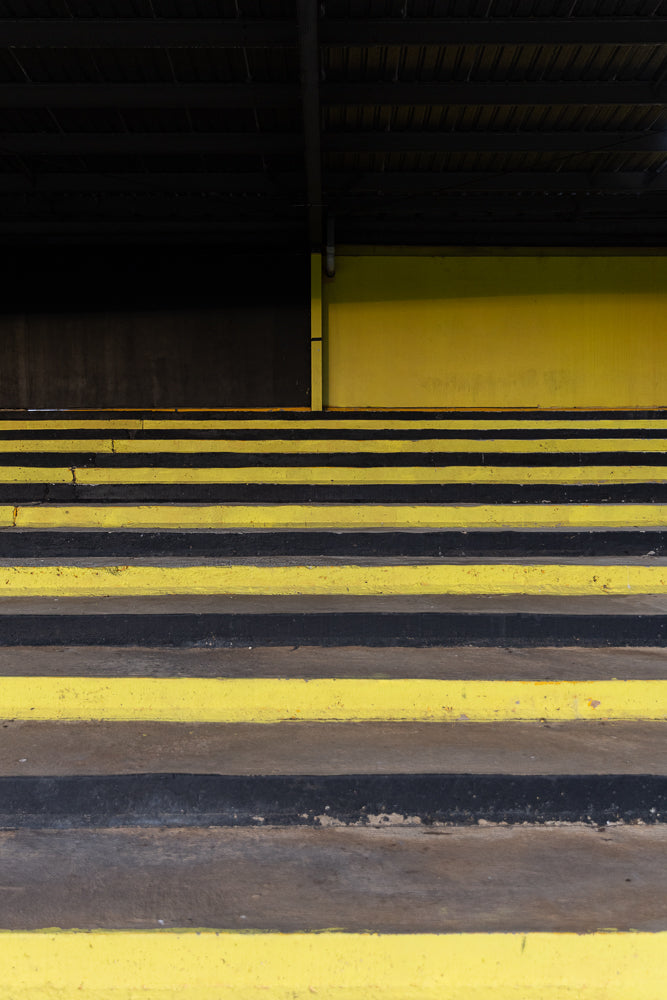 Yellow and black stripes creating abstract staircase pattern