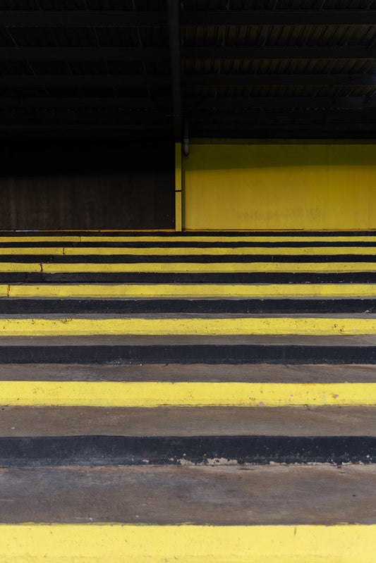 Yellow and black stripes creating abstract staircase pattern