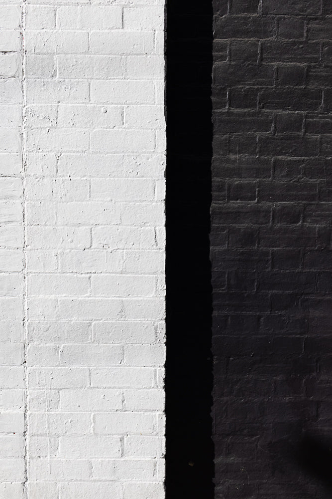 Contrasting white and black brick wall architecture