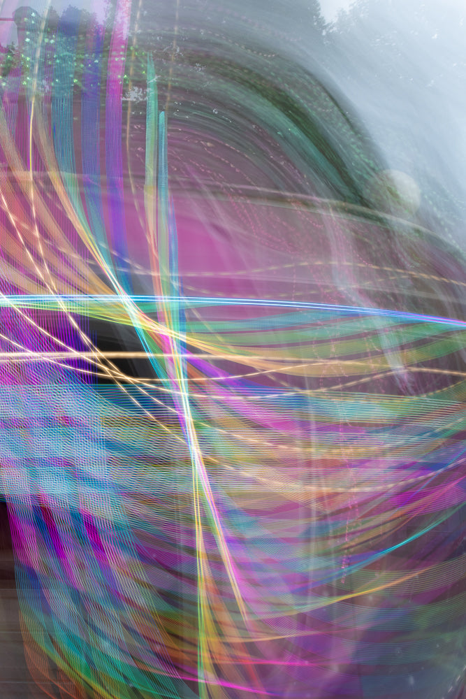 Abstract light trails creating colorful energy patterns