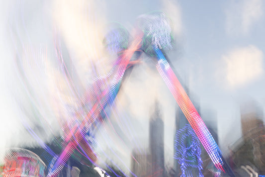 Colorful light trails from an amusement park ride