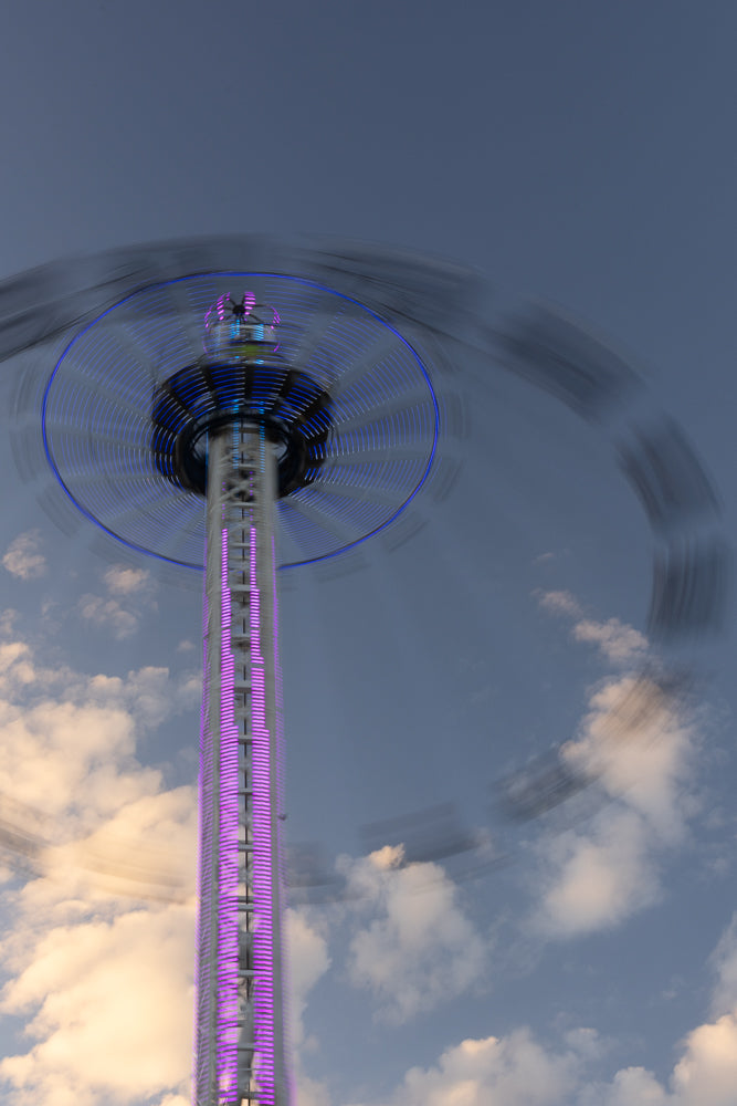Amusement park attraction spinning with motion blur