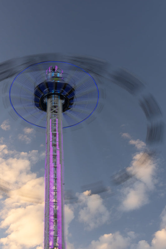 Amusement park attraction spinning with motion blur