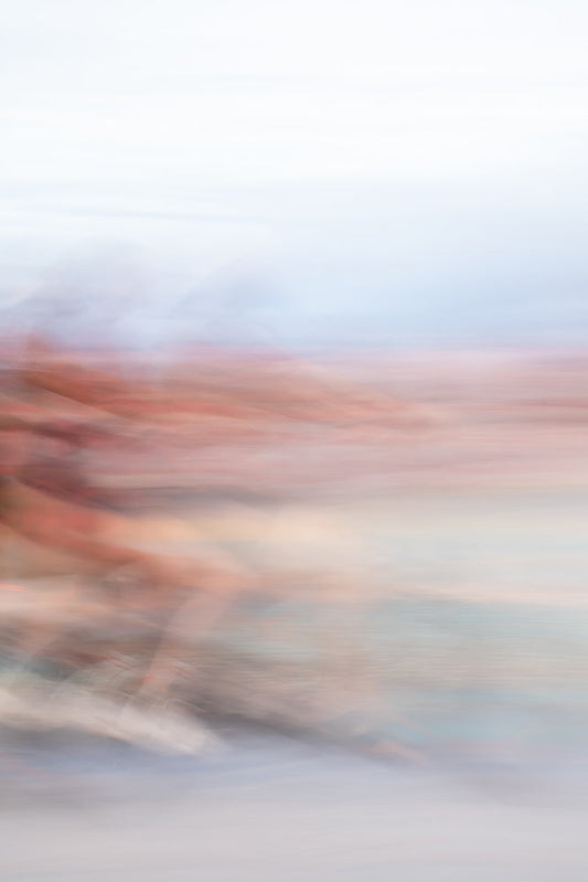 Abstract bike motion blur creating pastel, dreamy landscape