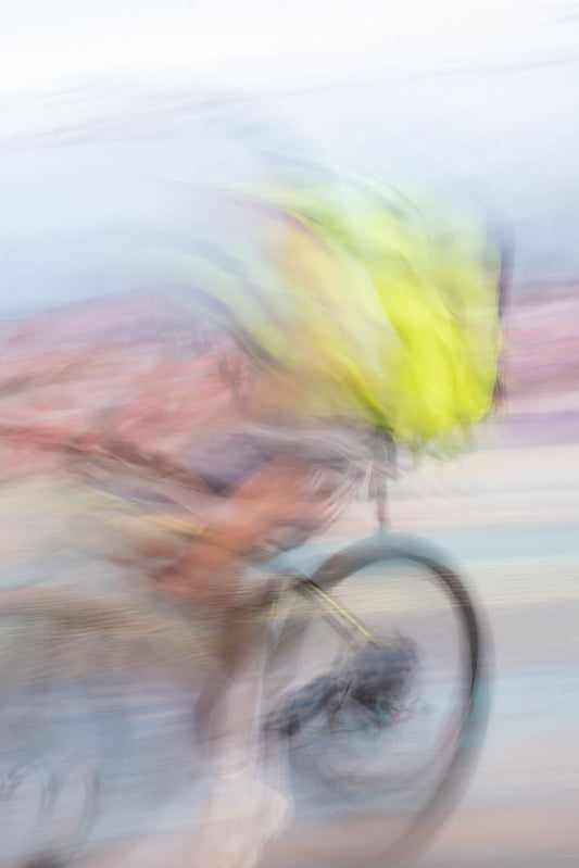 Cyclist creating speed motion blur on bicycle