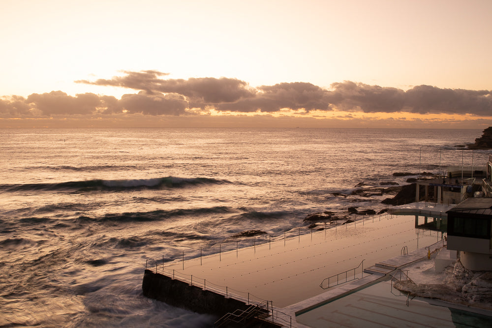 Ocean rock pool at pink sunrise