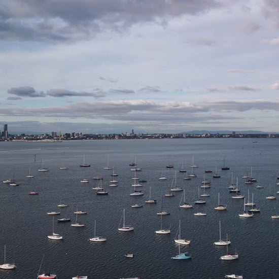Aerial view of yachts anchored in marina with Melbourne skyline