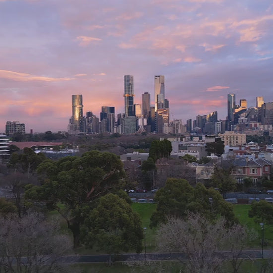 Aerial view of Melbourne skyline at sunrise, pan from Southbank to CBD