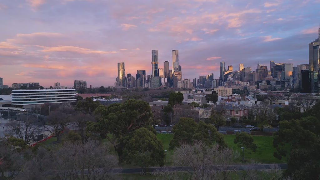 Aerial view of Melbourne skyline at sunrise, pan from Southbank to CBD