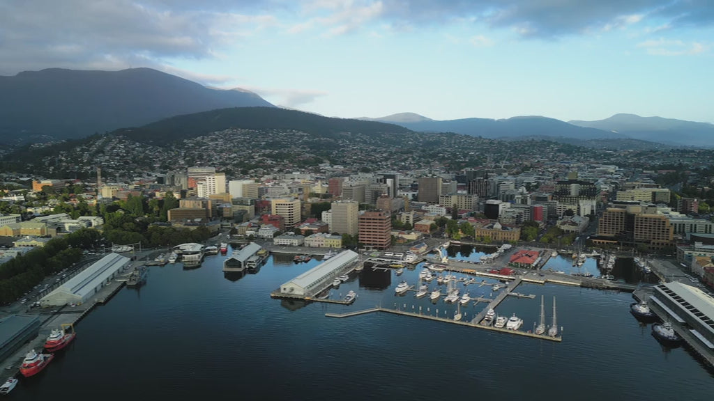 Aerial Hobart Harbour Waterfront and town day slow flying left