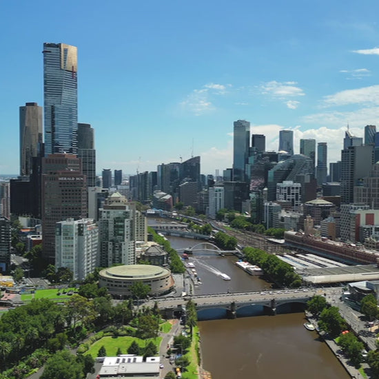 Aerial View Melbourne skyline and Yarra River extending to the bay