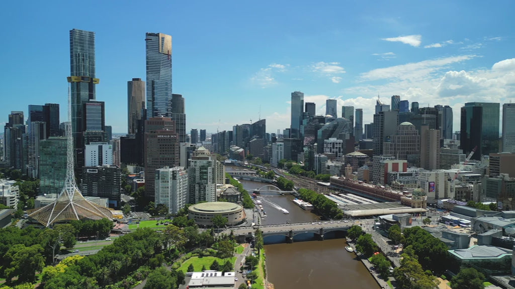 Aerial View Melbourne skyline and Yarra River extending to the bay