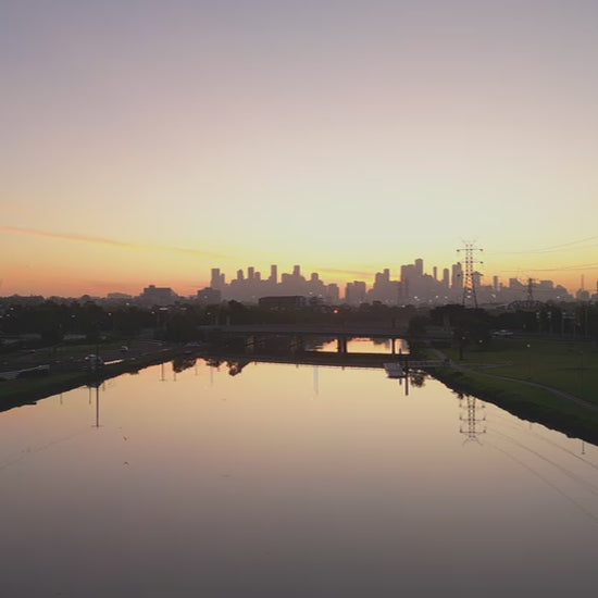 Aerial Maribyrnong River and Melbourne City at sunrise