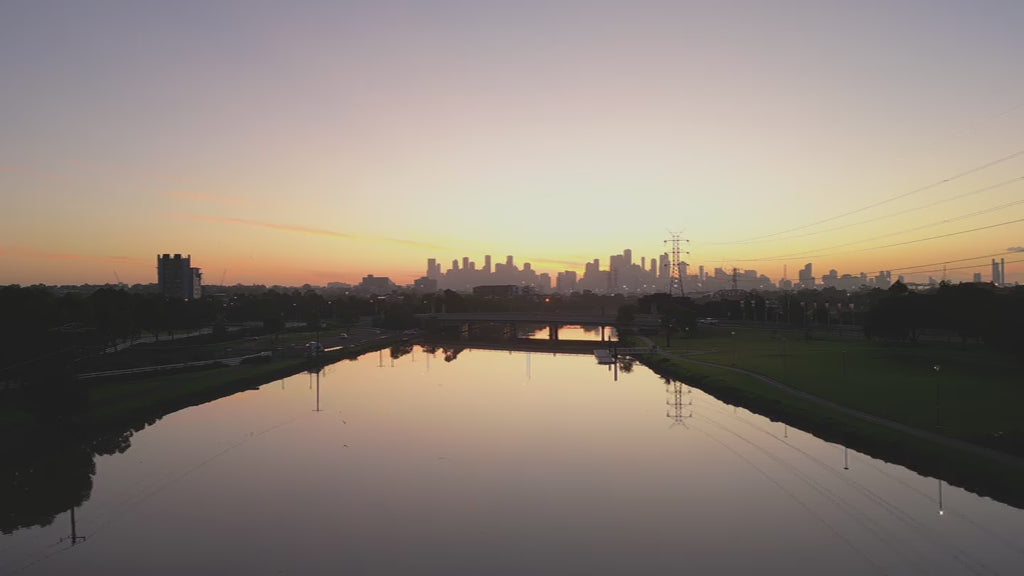 Aerial Maribyrnong River and Melbourne City at sunrise