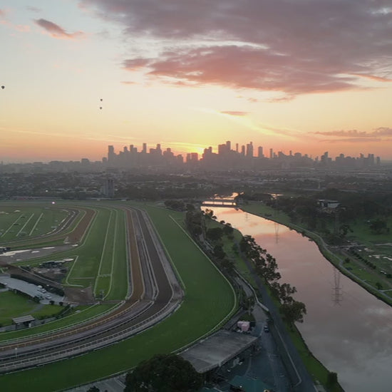 Aerial view Flemington Racecourse to Melbourne City at Sunrise
