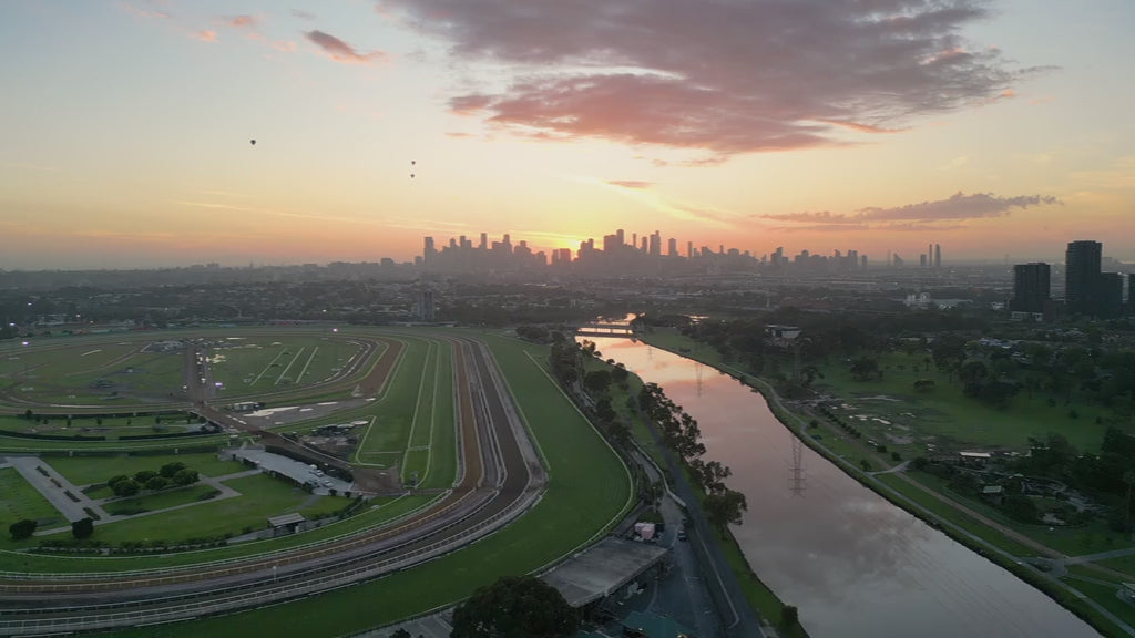Aerial view Flemington Racecourse to Melbourne City at Sunrise