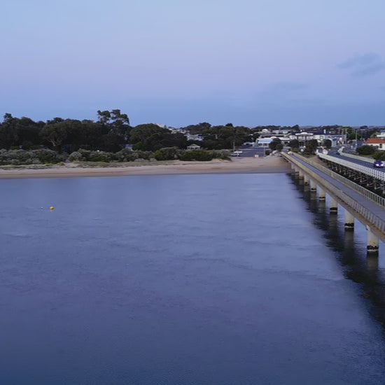Elevated view of Barwon Heads Bridge aerial, at dusk light