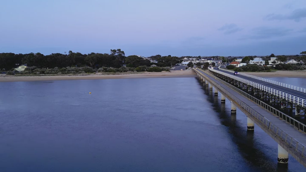 Elevated view of Barwon Heads Bridge aerial, at dusk light