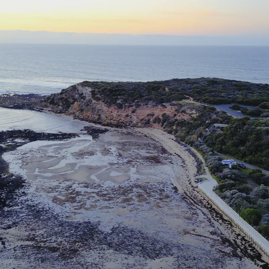 Aerial view of Barwon Heads Bluff at dawn, overlooking the vast ocean