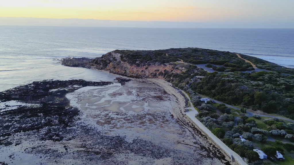 Aerial view of Barwon Heads Bluff at dawn, overlooking the vast ocean