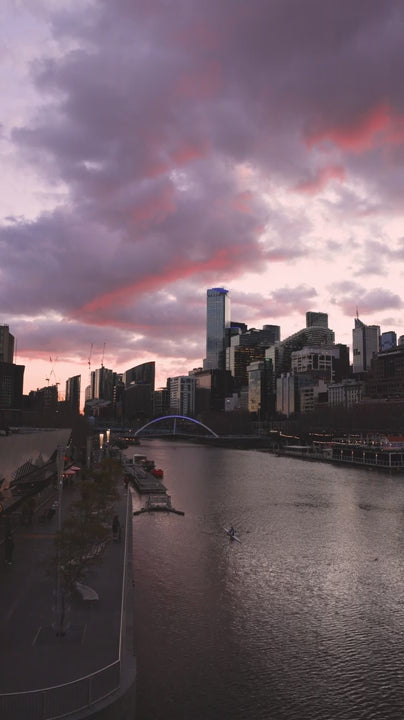 Melbourne skyline and Yarra River at beautiful pink and purple sunset showcasing the beauty of Melbourne